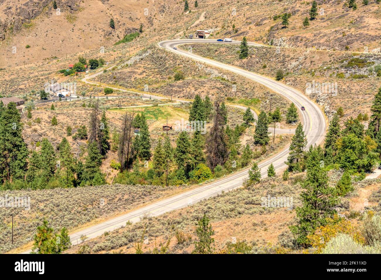 S-shaped road in Rocky mountains on summer day Stock Photo