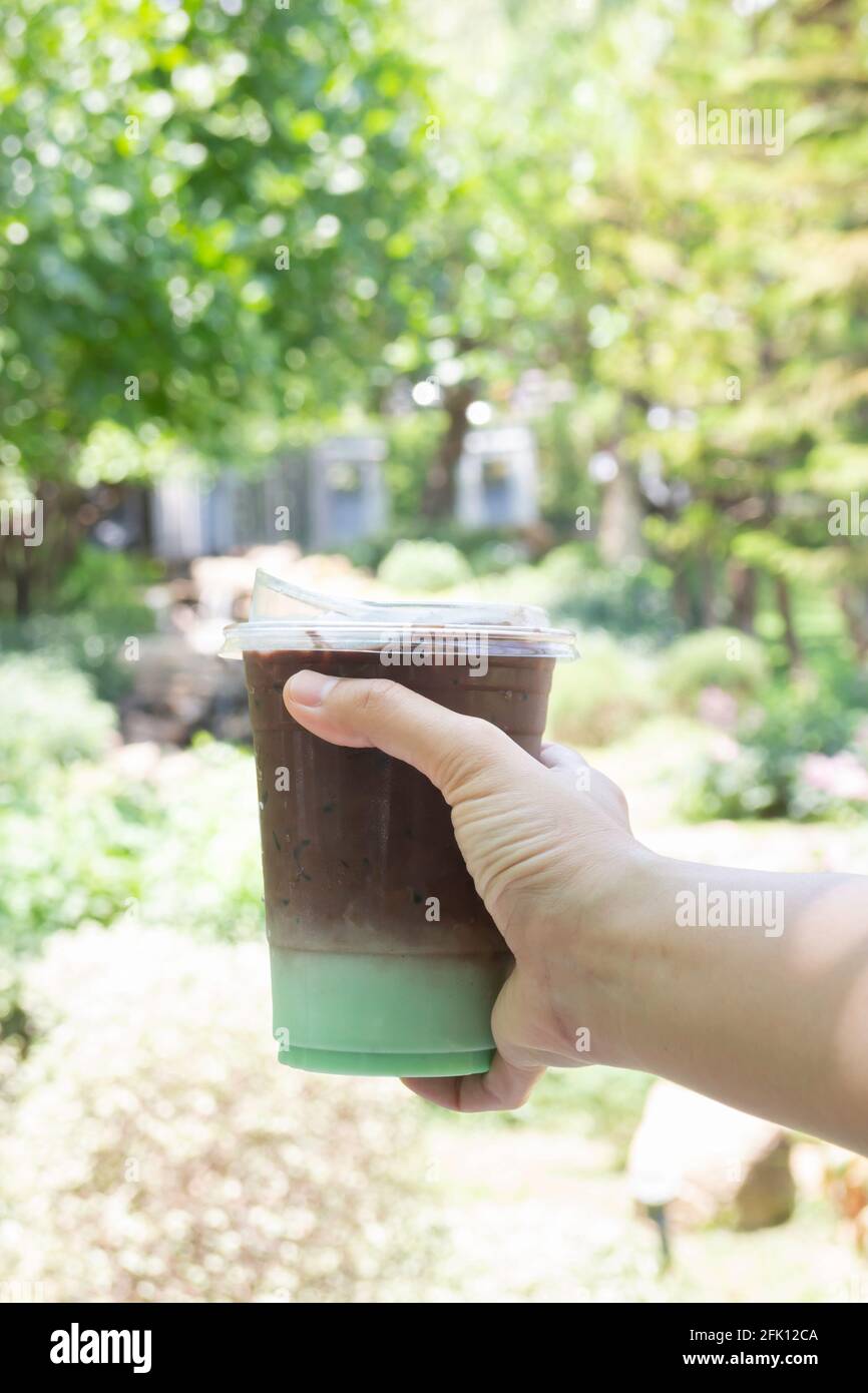 Female hand holding iced coffee hi-res stock photography and images - Alamy