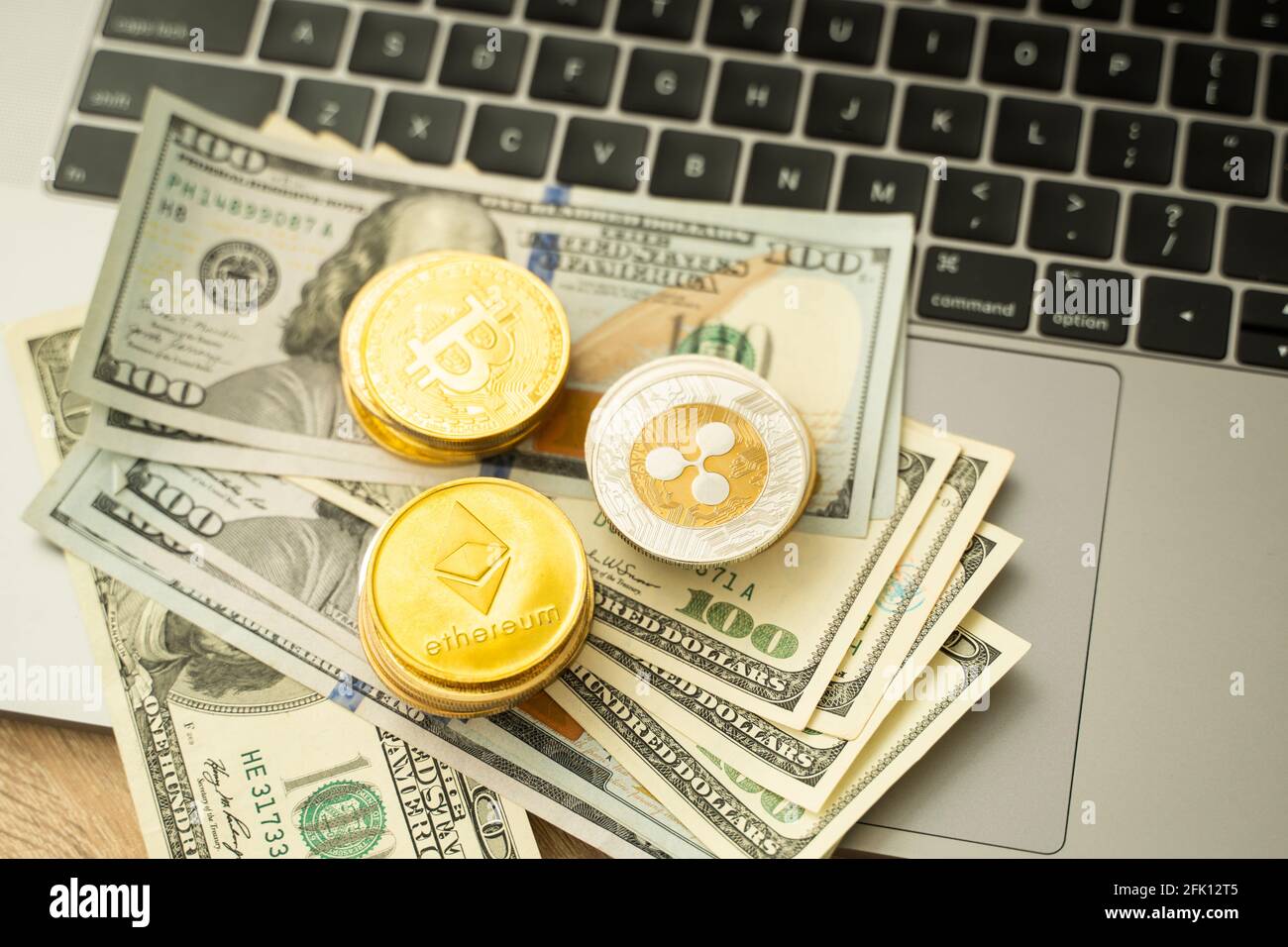 Ethereum coins and bitcoin on a dollars and on a laptop. Trading on the  cryptocurrency exchange. Cryptocurrency Stock Market Concept. Mining or  Stock Photo - Alamy