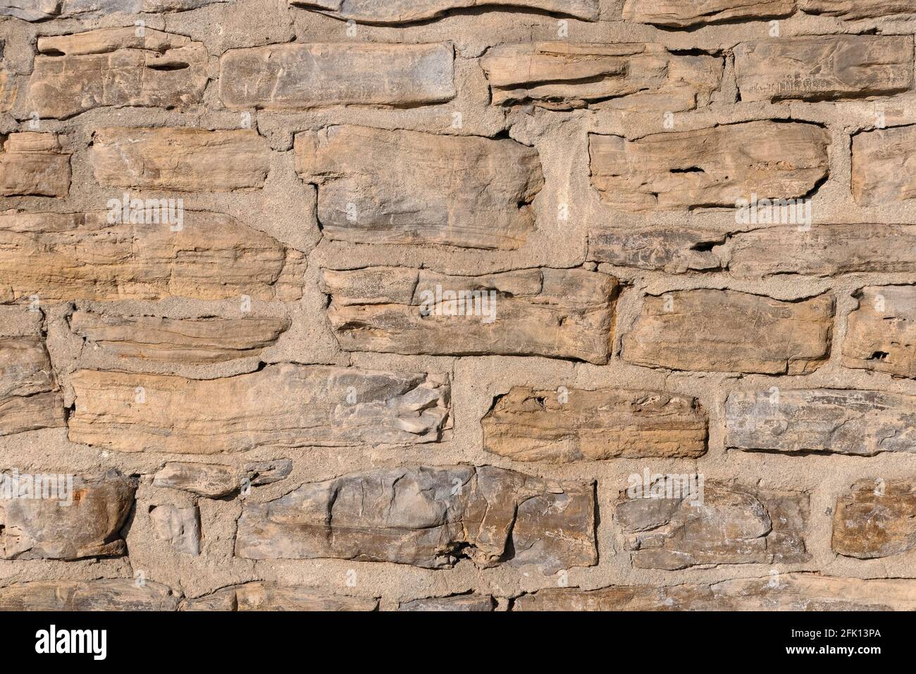 Wall made of natural stones Stock Photo