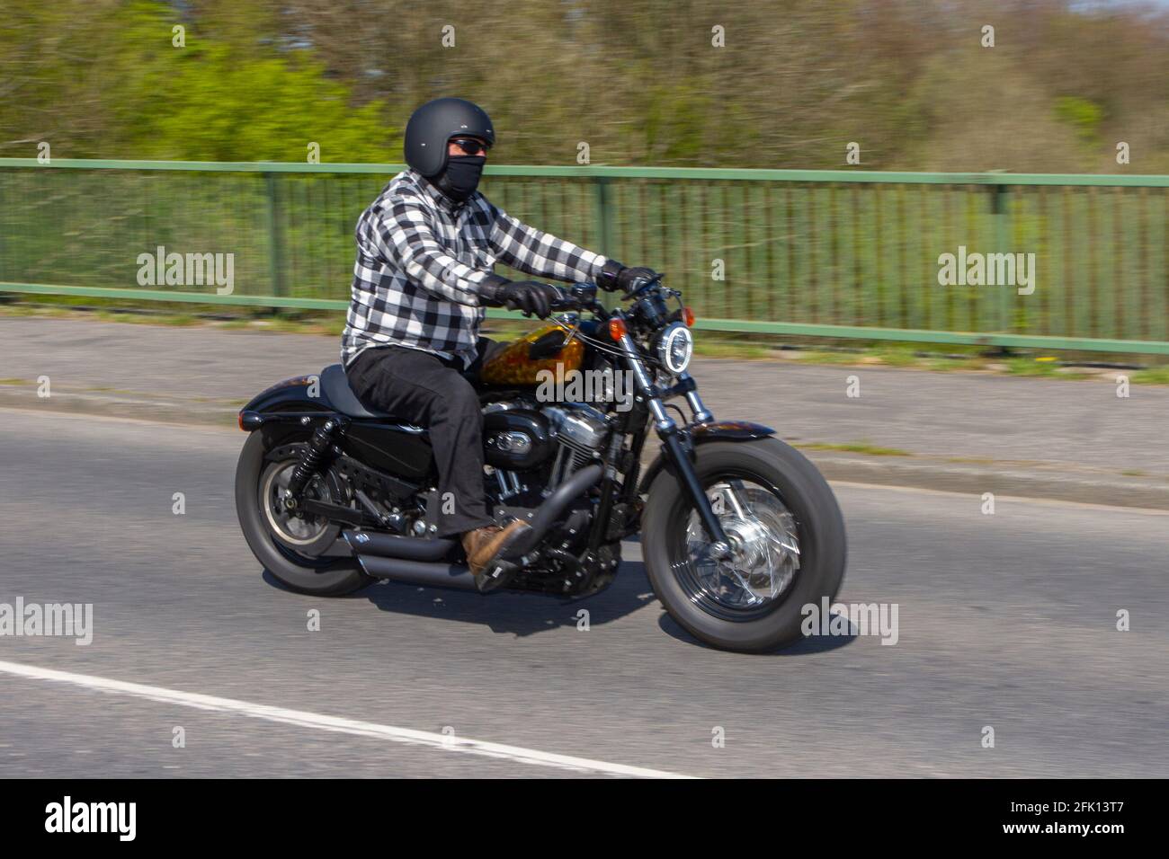 2011 Harley Davidson Xl1200 Forty Eight; Motorbike rider; two wheeled transport, motorcycles, vehicle on British roads, motorbikes, motorcycle bike riders motoring in Manchester, UK Stock Photo