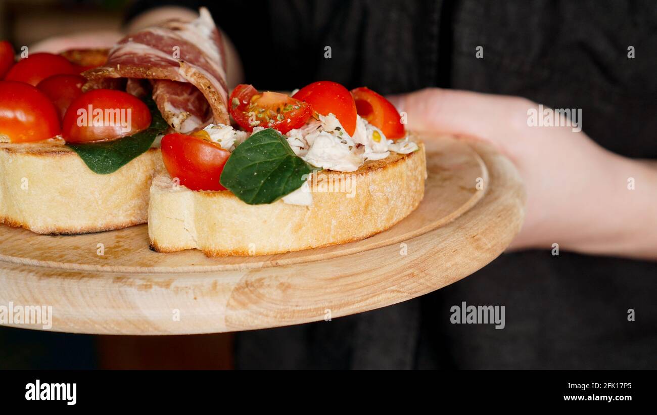 Waiter holding fast food tray hi-res stock photography and images - Alamy