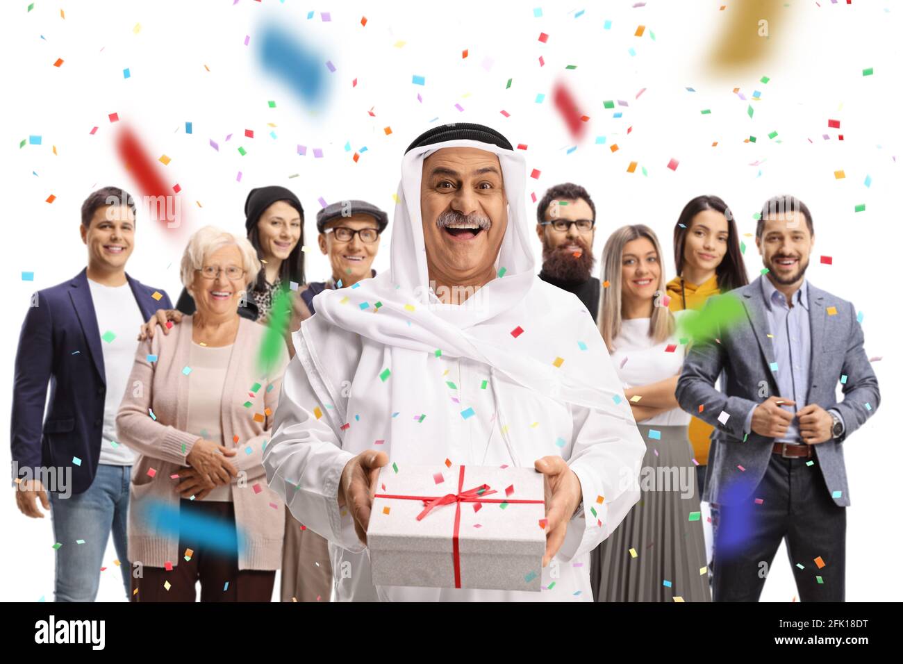 Arab man holding a present and celebrating birthday with family isolated on white background Stock Photo