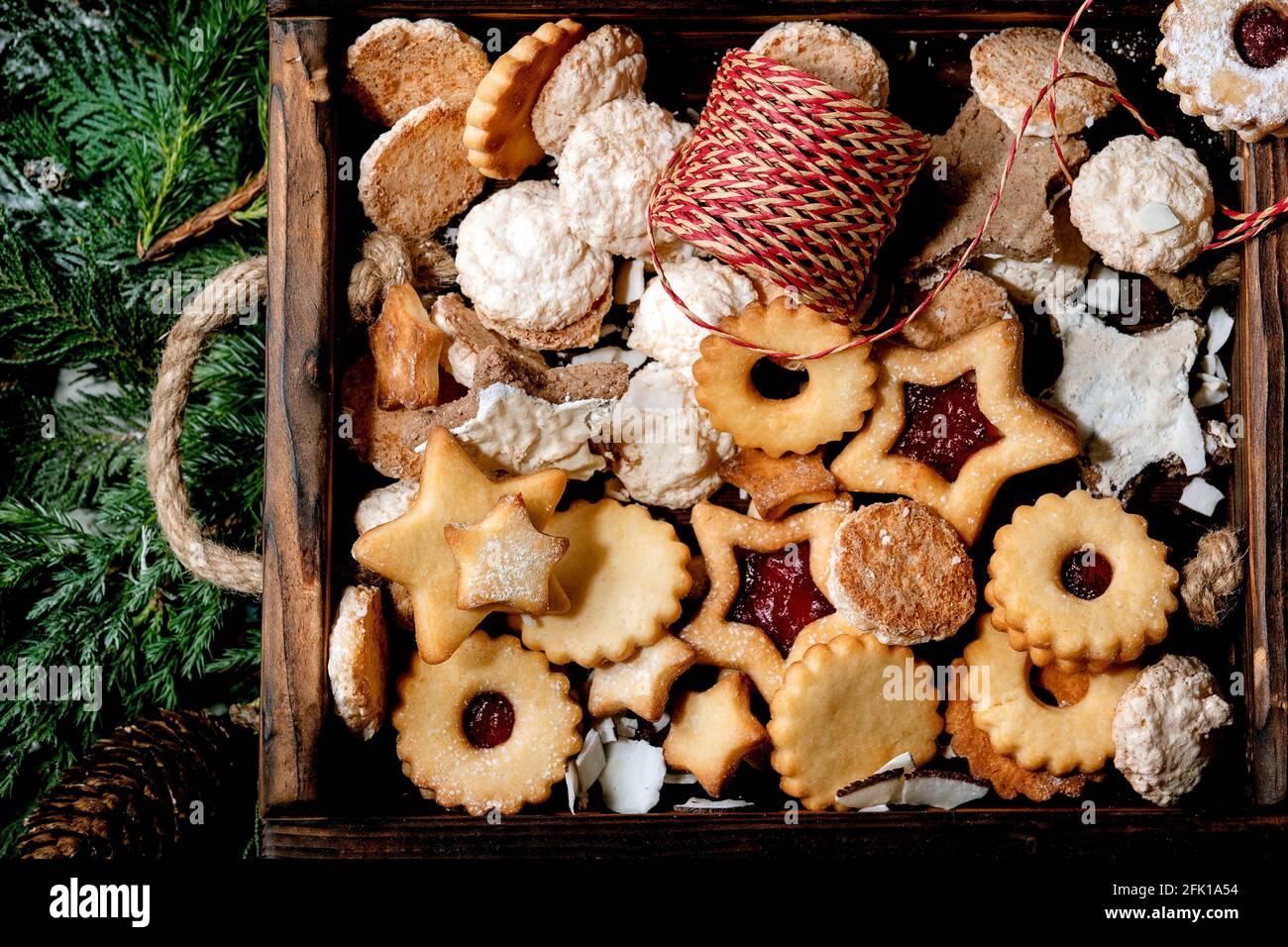 https://c8.alamy.com/comp/2FK1A54/christmas-homemade-shortbread-biscuits-cookies-collection-different-shapes-include-traditional-linz-biscuits-with-red-jam-in-wooden-tray-over-thuja-b-2FK1A54.jpg