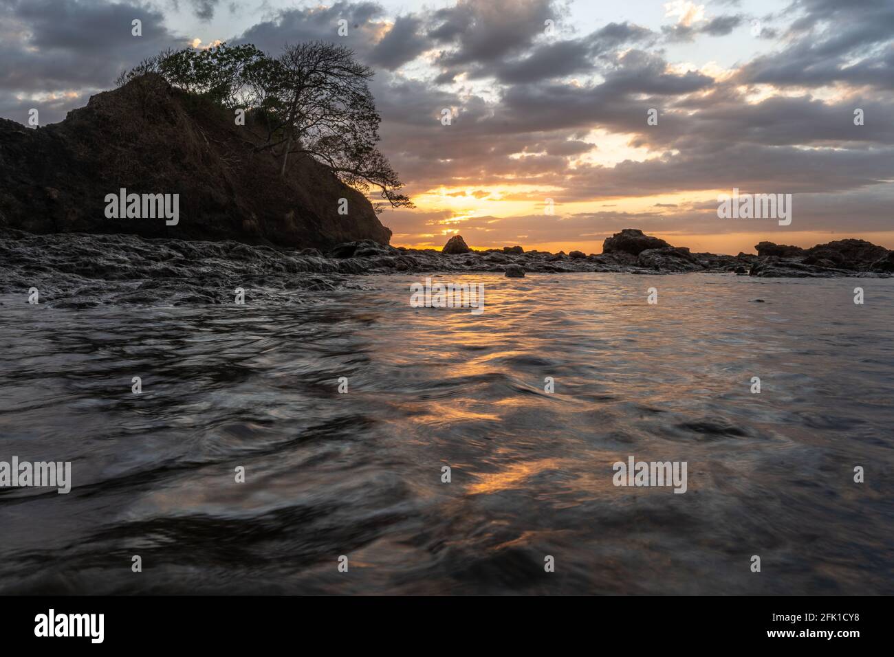 PANAMA, PANAMA - Apr 25, 2021: Beautiful sunset on the beach on a high tid Stock Photo