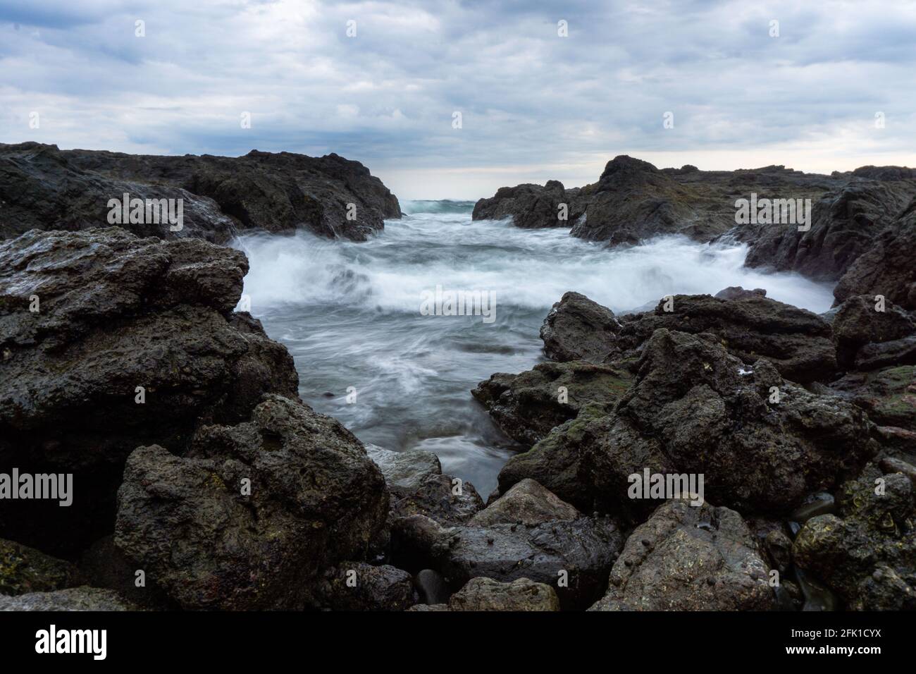 PANAMA, PANAMA - Apr 25, 2021: sunset of a rocky beach shore Stock Photo