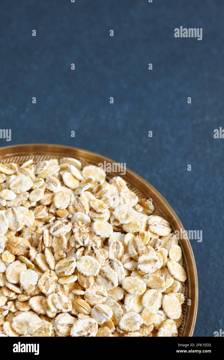 Close up picture of barley flakes in a bowl, selective focus. Stock Photo