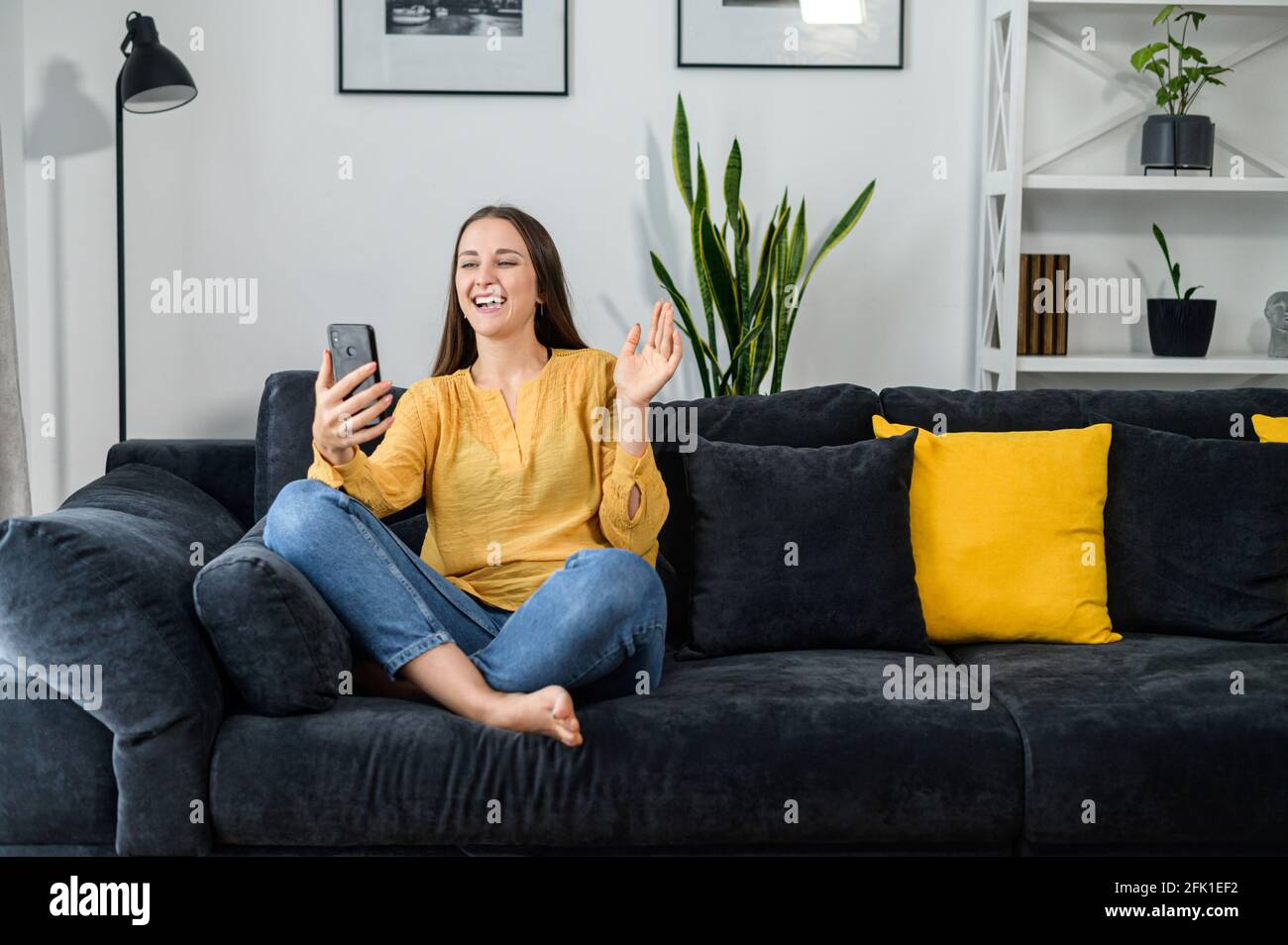 A woman meets with friends using online video call virtual