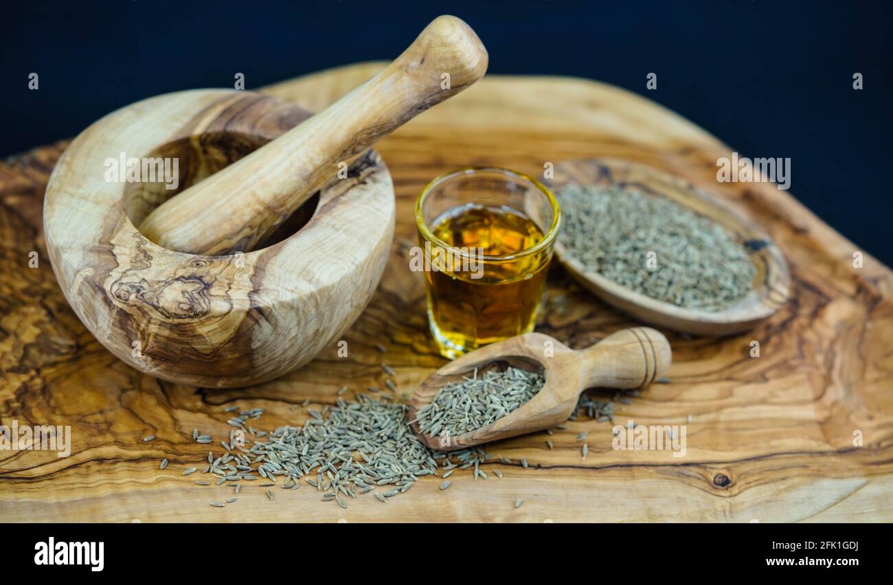 Cumin oil and olive wood Stock Photo