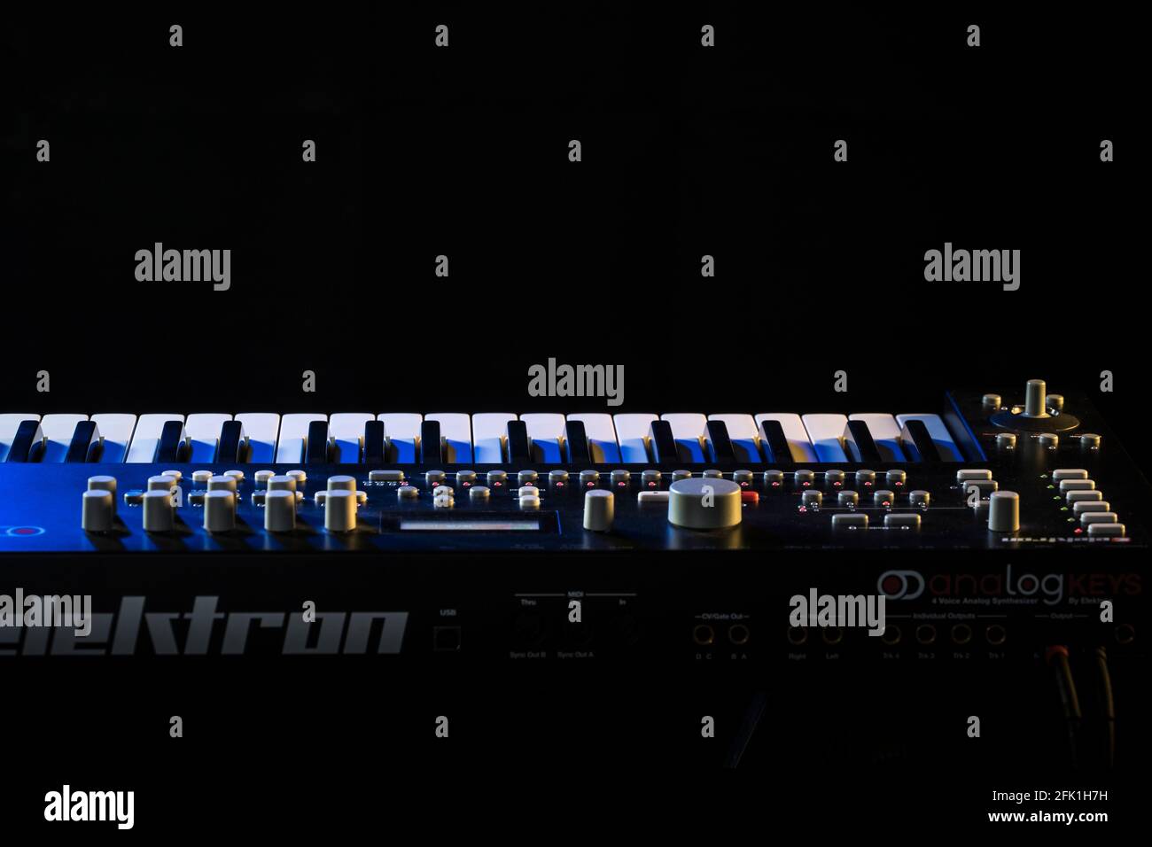 Complex synth keyboard in stage lighting Stock Photo Alamy