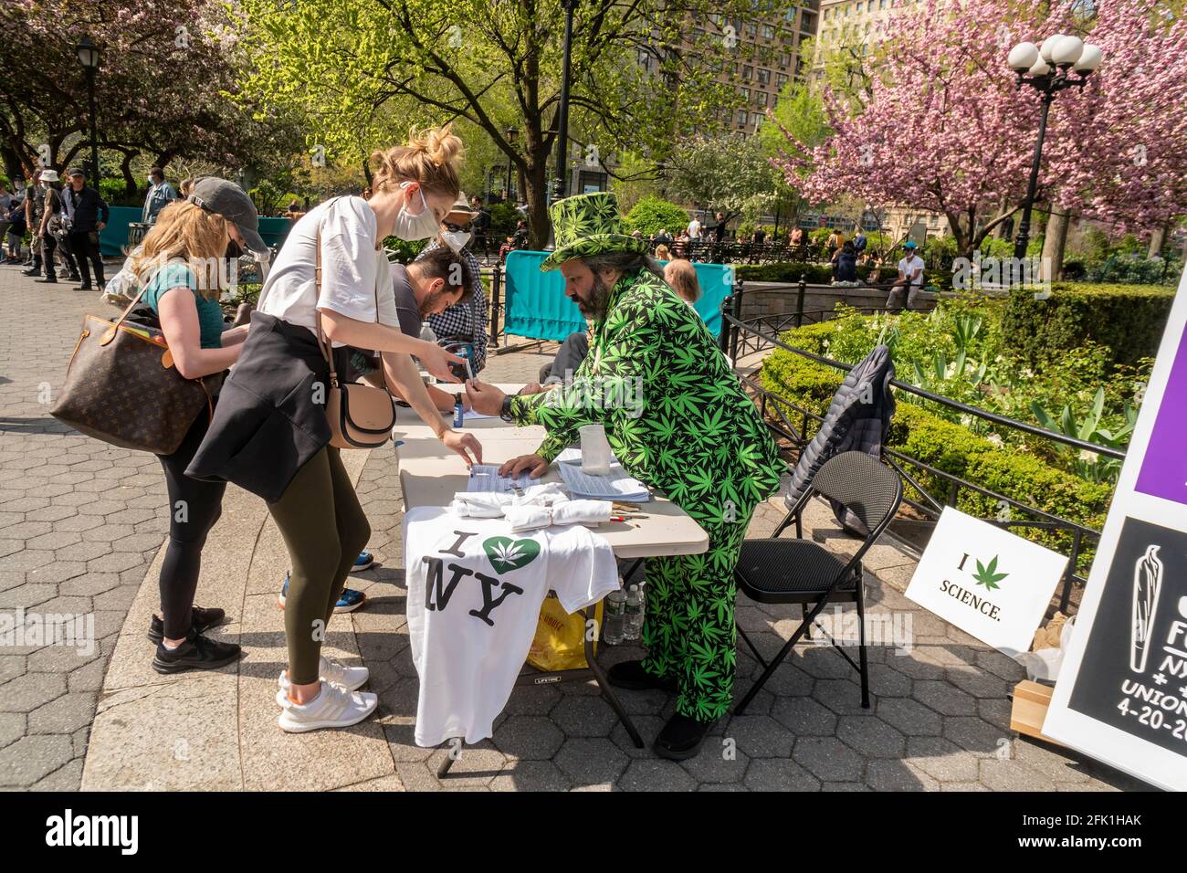 Marijuana activists distribute free joints in Union Square Park in New York on “420 Day”, Tuesday, April 20, 2021. The activists were celebrating the legalization of marijuana in New York by distributing the joints upon presentation of proof of COVID-19 vaccination. (© Richard B. Levine) Stock Photo