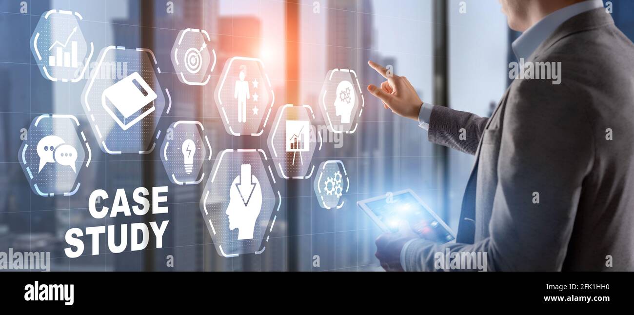 Businessman pressing case study button on virtual screens. Stock Photo