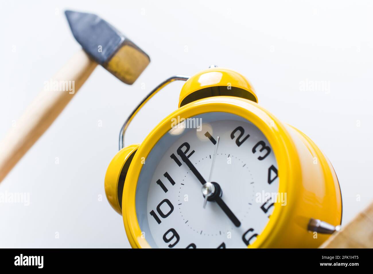 Hammer Smashing Alarm Clock At 6 O'Clock In The Morning Stock Photo - Alamy