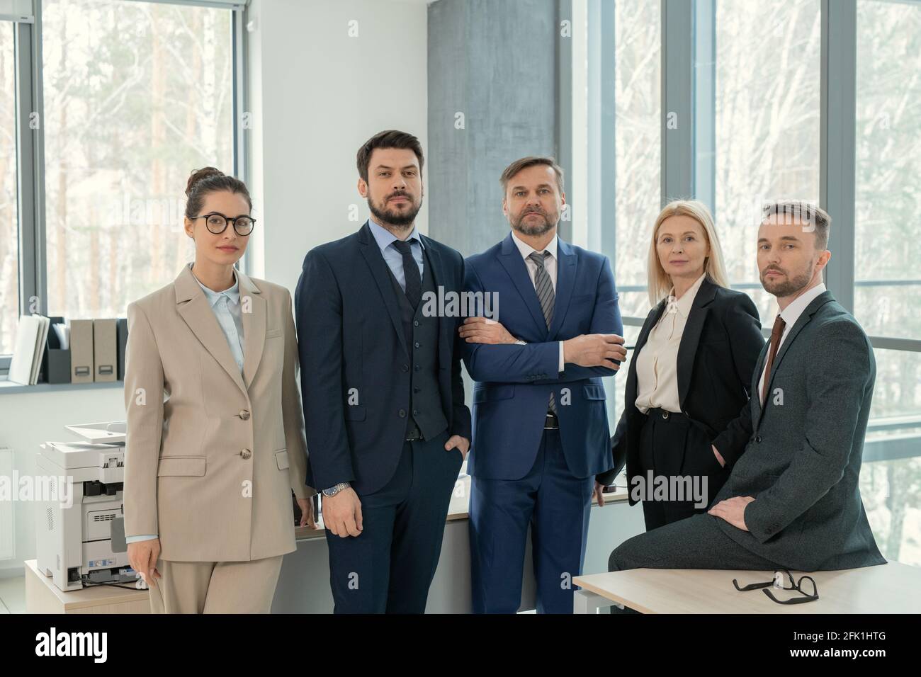 Business people in suits standing hi-res stock photography and images ...