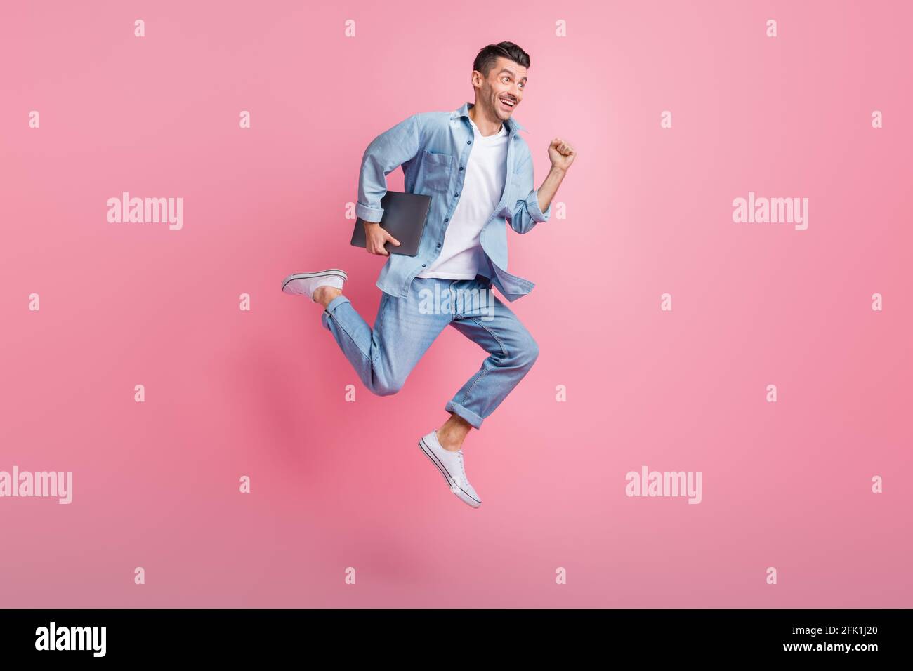 Full length body size photo of jumping programmer with computer running ...