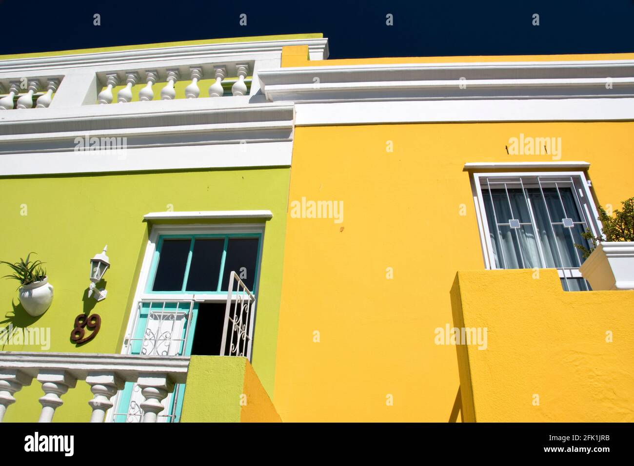 Colorful houses draw tourists to the Bo-Kaap neighborhood in Cape Town, South Africa. Stock Photo