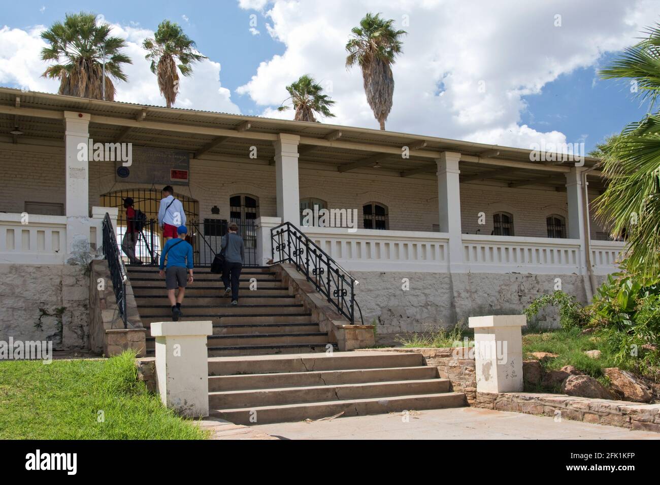 A tour guide describes the Alte Feste (Old Fortress), the HQ of the German military during colonization of South-West Africa, Windhoek, Namibia. Stock Photo