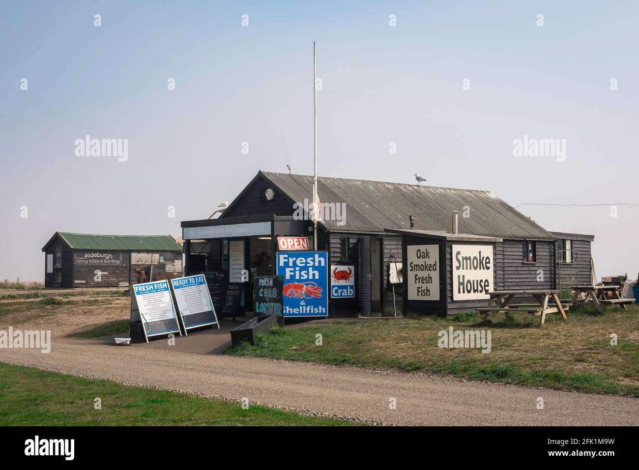 Aldeburgh Suffolk UK, view of traditional fresh fish huts selling smoked fish and shellfish sited along the beach at Aldeburgh, Suffolk, UK. Stock Photo