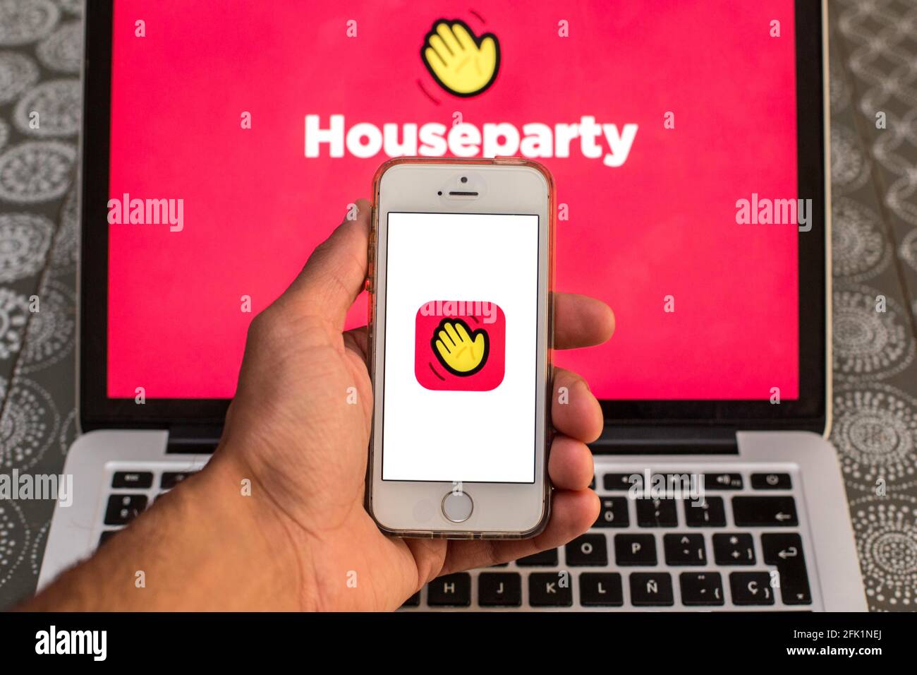 Spain. 27th Apr, 2021. In this photo illustration a Houseparty app seen displayed on a smartphone screen with a Houseparty logo displayed on a laptop in the background. (Photo by Thiago Prudencio/SOPA Images/Sipa USA) Credit: Sipa USA/Alamy Live News Stock Photo