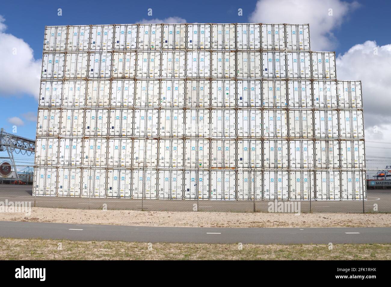 Maersk Sea containers stacked on top of each other in the Maasvlakte harbor in the port of Rotterdam Stock Photo