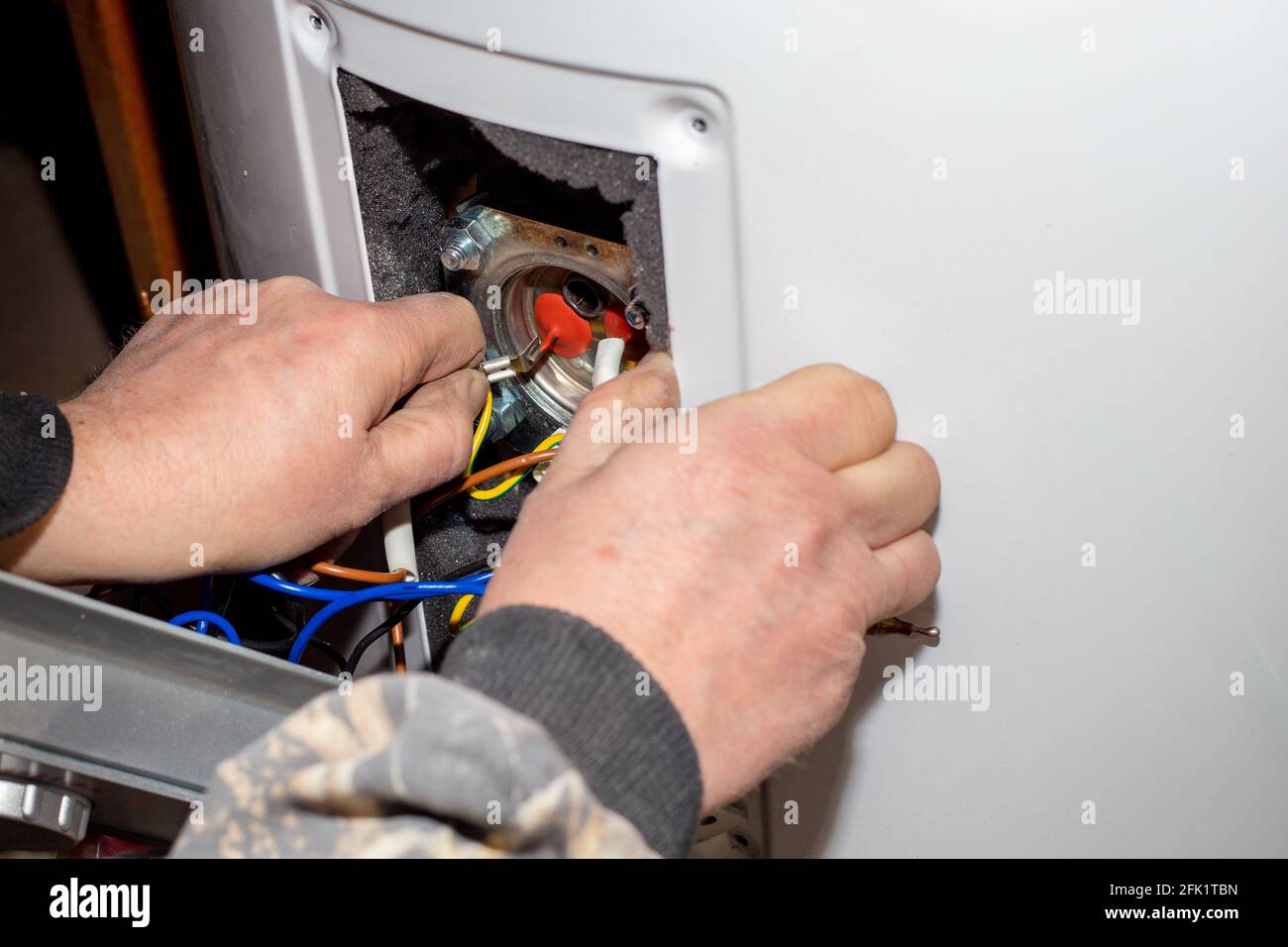 The foreman disassembled the electric boiler for repair and maintenance
