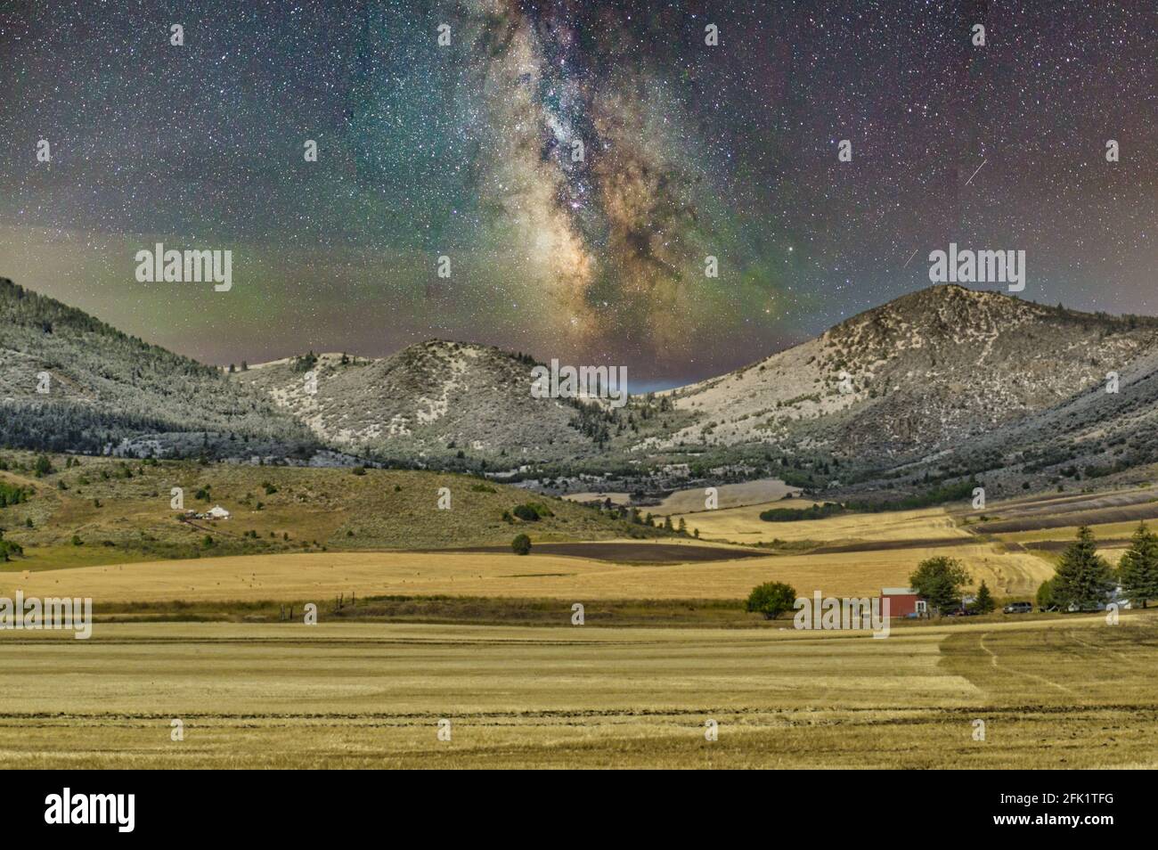 Milky Way in a beautiful starry night sky above mountains Stock Photo ...