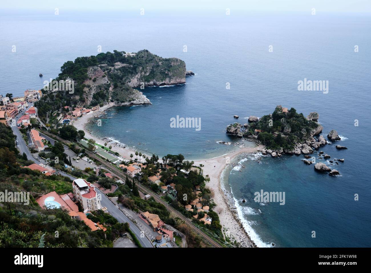 Isola Bella island and the Grotta Azzurra peninsula near Taormina in Sicily, Italy. Known as the The Pearl of the Ionian Sea. Stock Photo