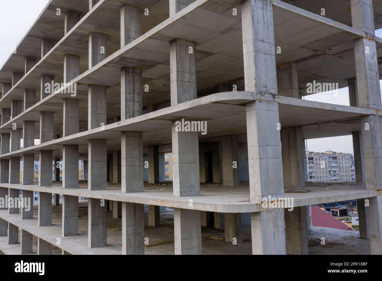 Aerial view of concrete frame of tall apartment building under ...