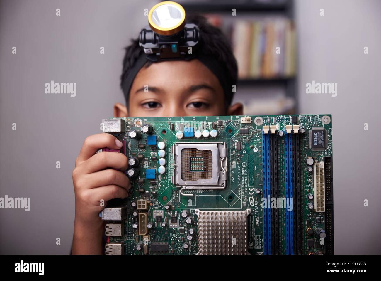 Student boy Studying and repairing Pc motherboard in the Computer Lab Stock  Photo - Alamy
