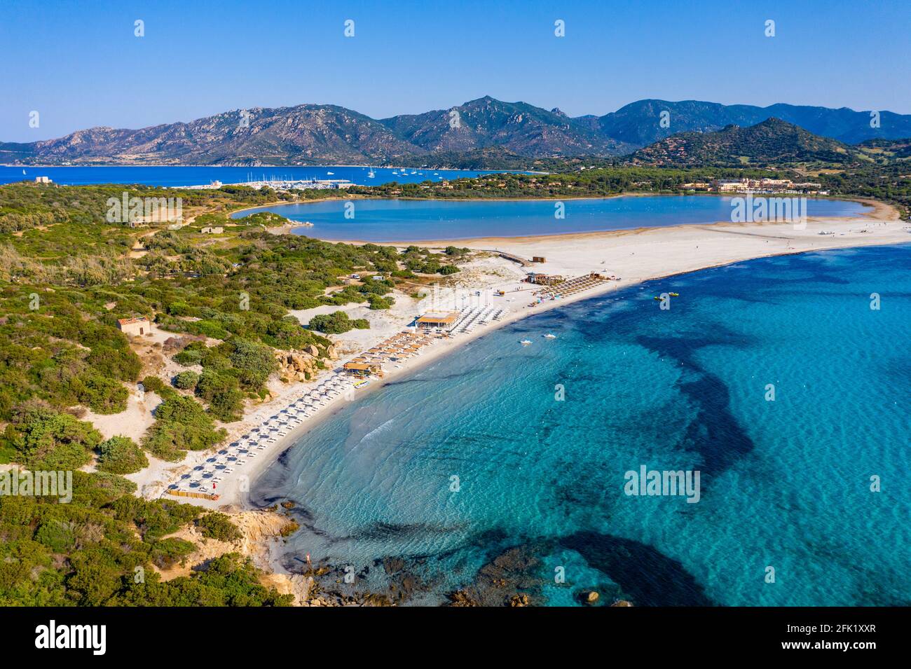 Panoramic view of sandy beach, yachts and sea with azure water, in