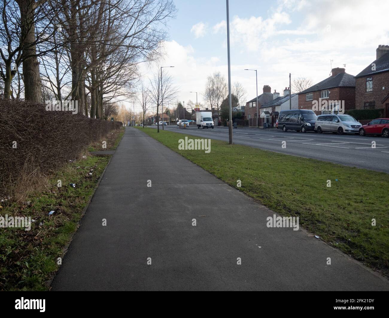 Day traffic on busy road in Baguley ,Wythenshawe ,England. Early 2021