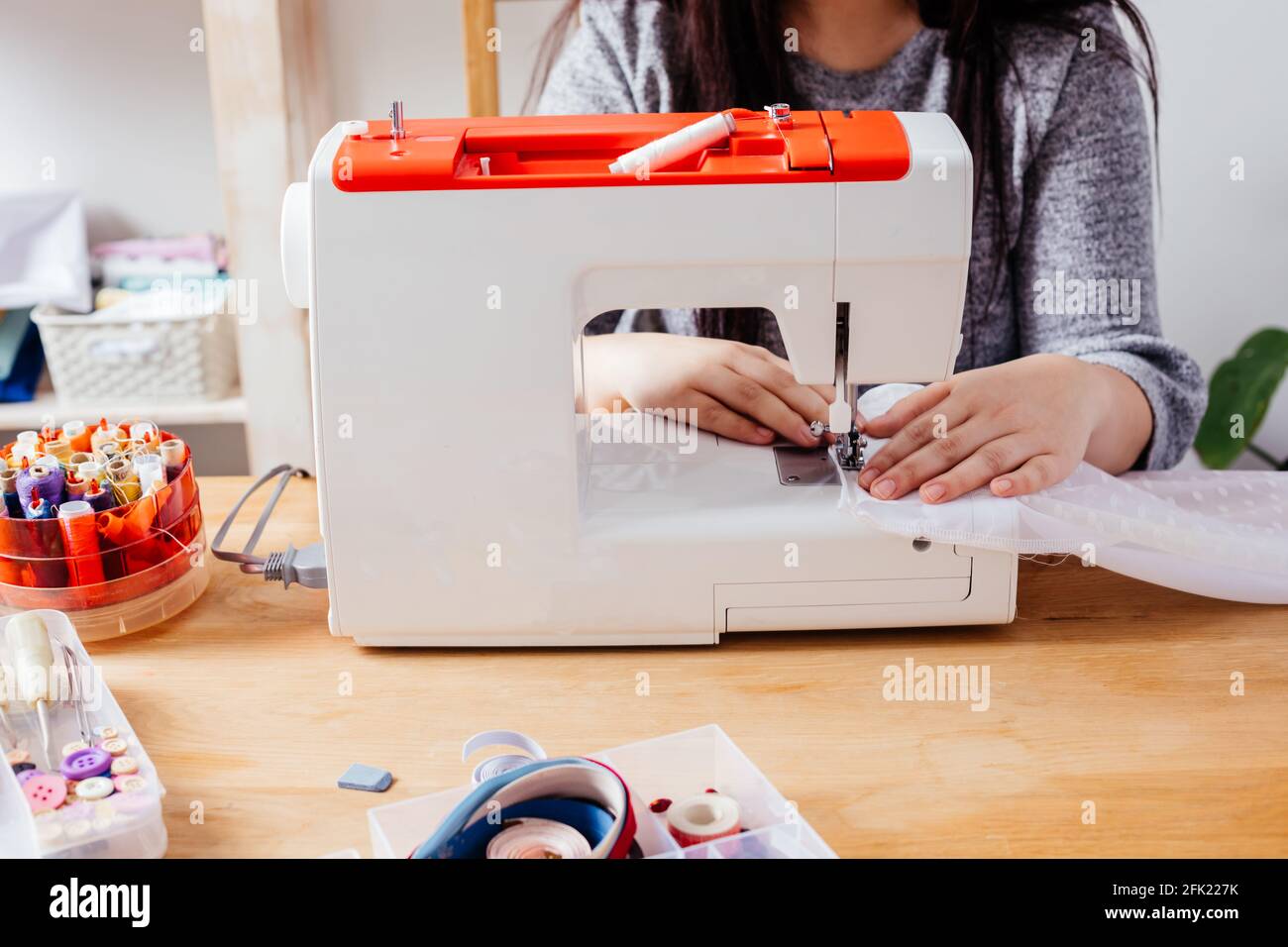 Wedding dressmaker altering white vintage wedding dress Stock Photo Alamy