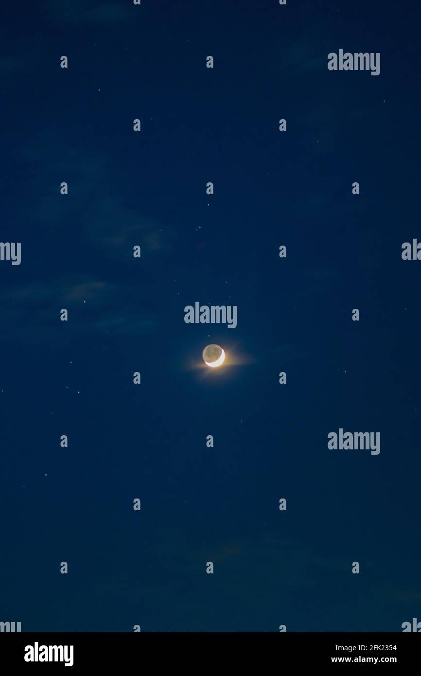 Waxing crescent moon over West Sussex, UK Stock Photo Alamy