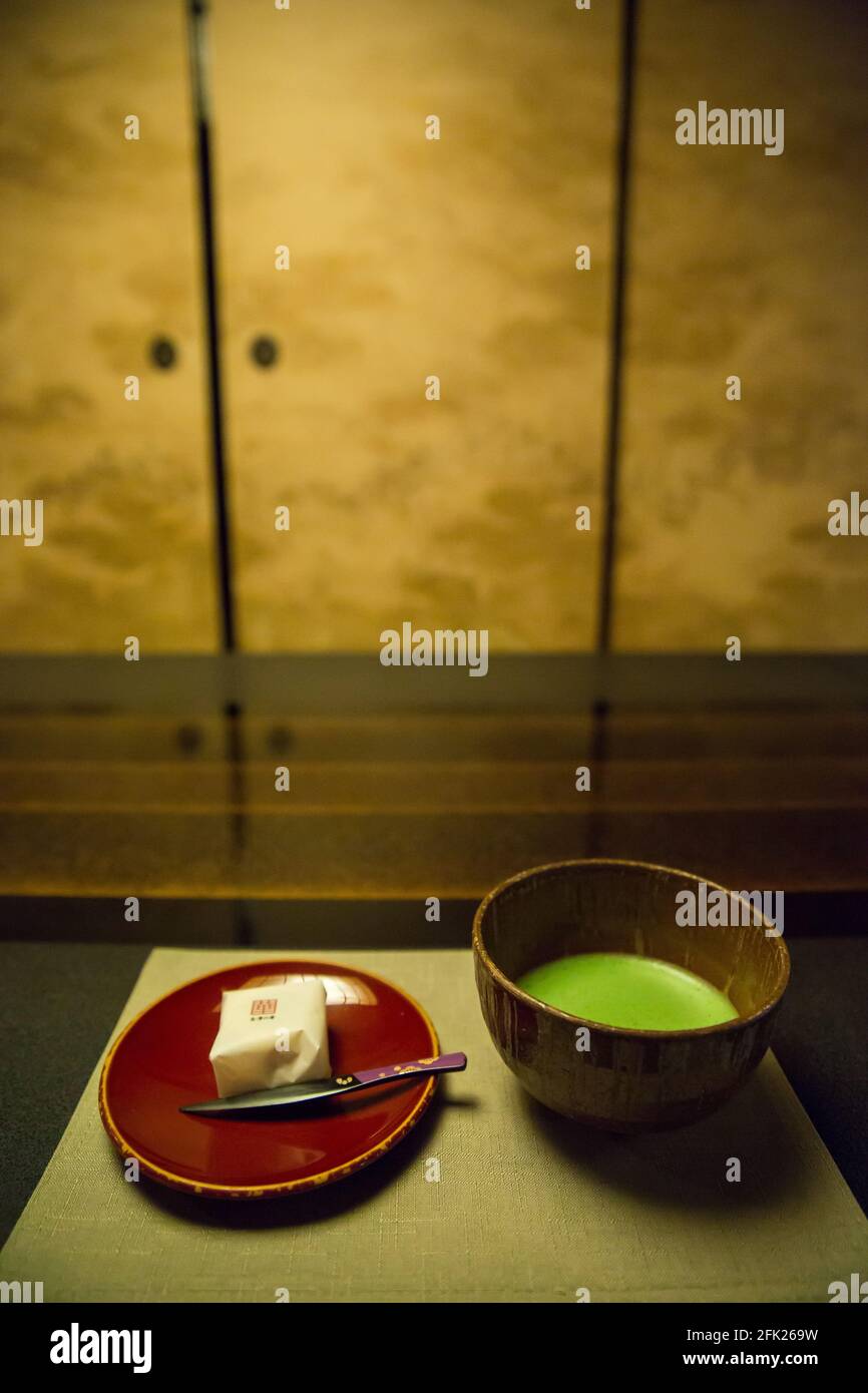 Matcha green tea ceremony with Wagashi sweets. Machiya Tea House interior, edo district of ancient Japanese town Kanazawa. Japan. Stock Photo