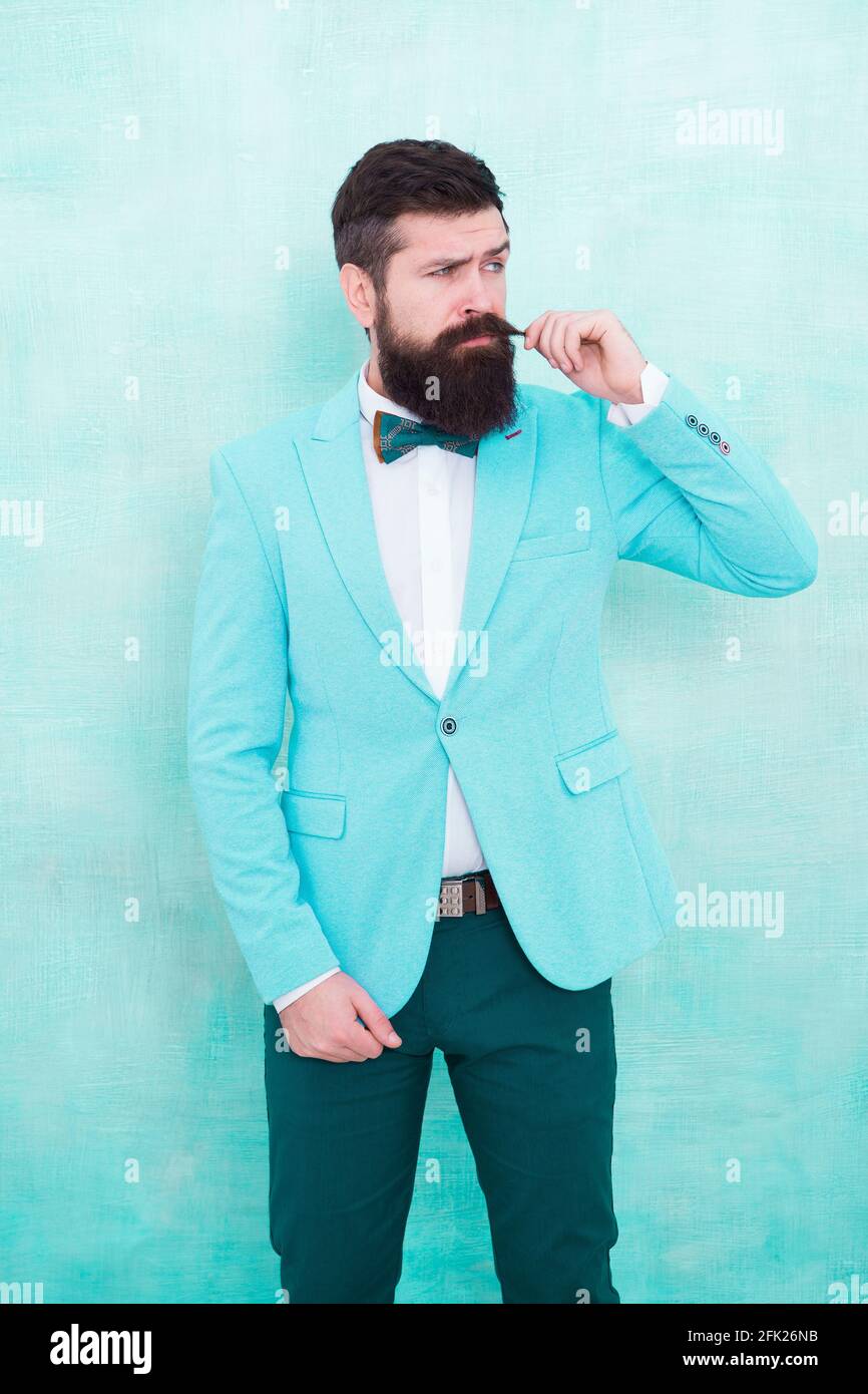 Teenager Isaac videnskabsmand Statement with his stunning crisp suit jacket. Stylist fashion expert. Suit  style. Fashion trends for groom. Groom bearded hipster man wear light blue  tuxedo and bow tie. Wedding day. Stylish groom Stock