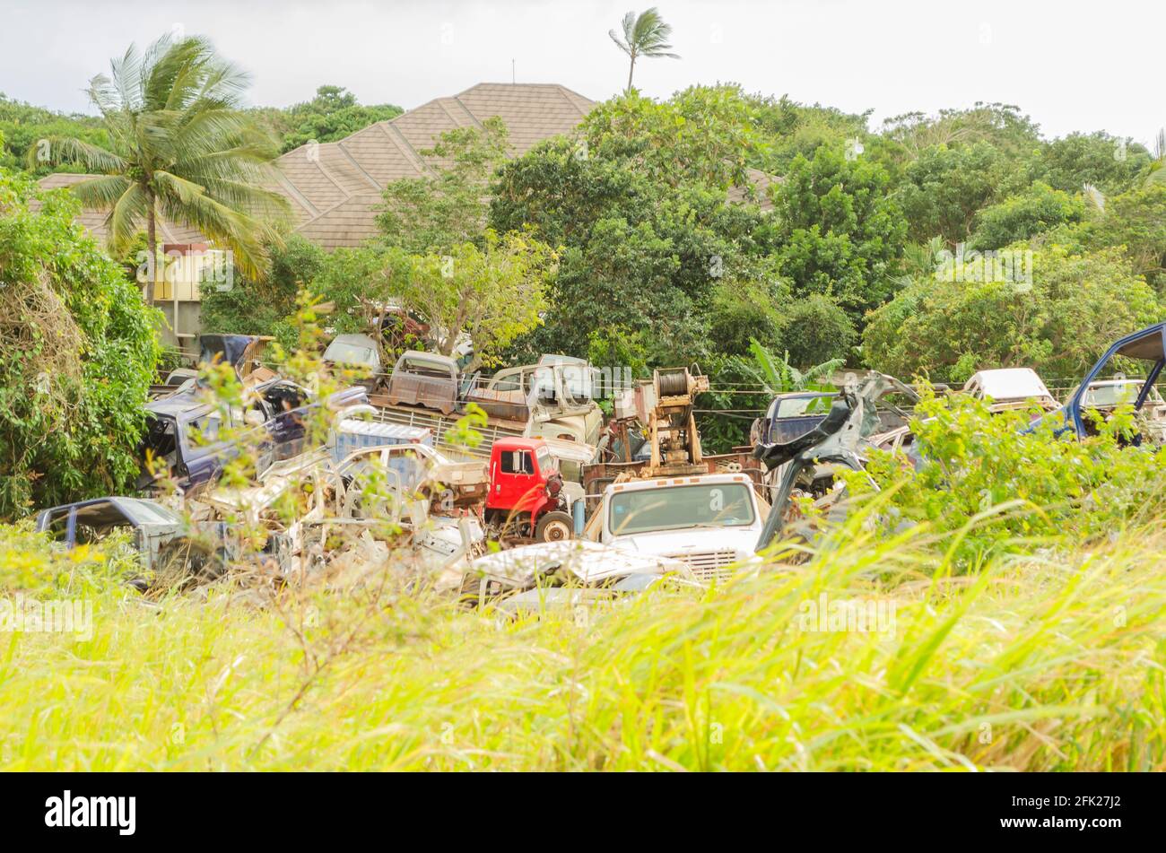 Scrap Yard Among Grass Surrounded By Grass And Trees Stock Photo Alamy