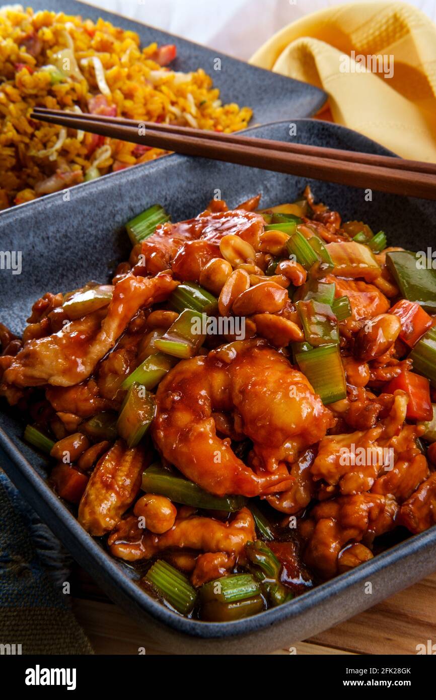 Takeout Chinese Kung Pao Chicken And Shrimp With Peanuts And Side Of Pork Fried Rice Stock Photo Alamy
