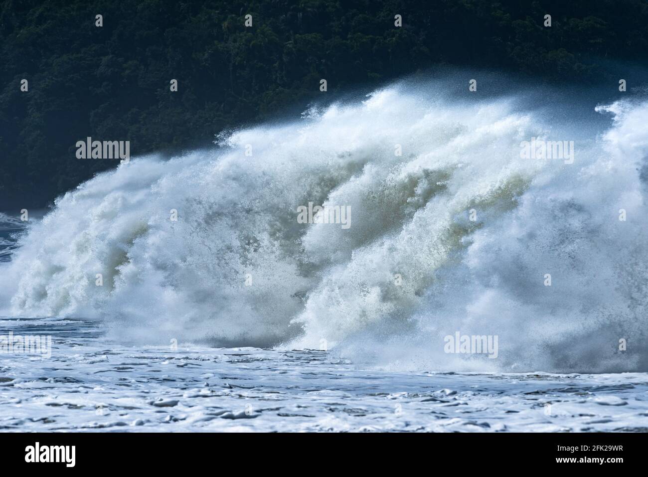 Breaking wave in Castelhanos Beach, Ilhabela, Brazil Stock Photo