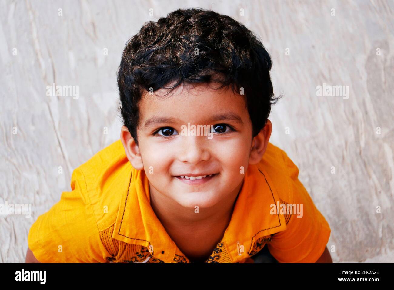 three year age indian baby boy in yellow shirt close up Stock Photo - Alamy