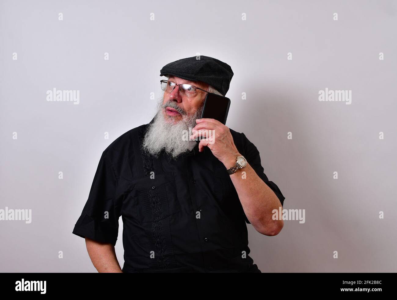 Senior man talking on the smartphone Stock Photo