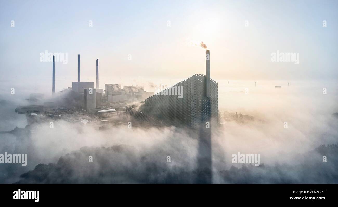 Distant view with clouds. CoppenHill Power Plant, Copenhagen, Denmark. Architect: BIG Bjarke Ingels Group, 2019. Stock Photo