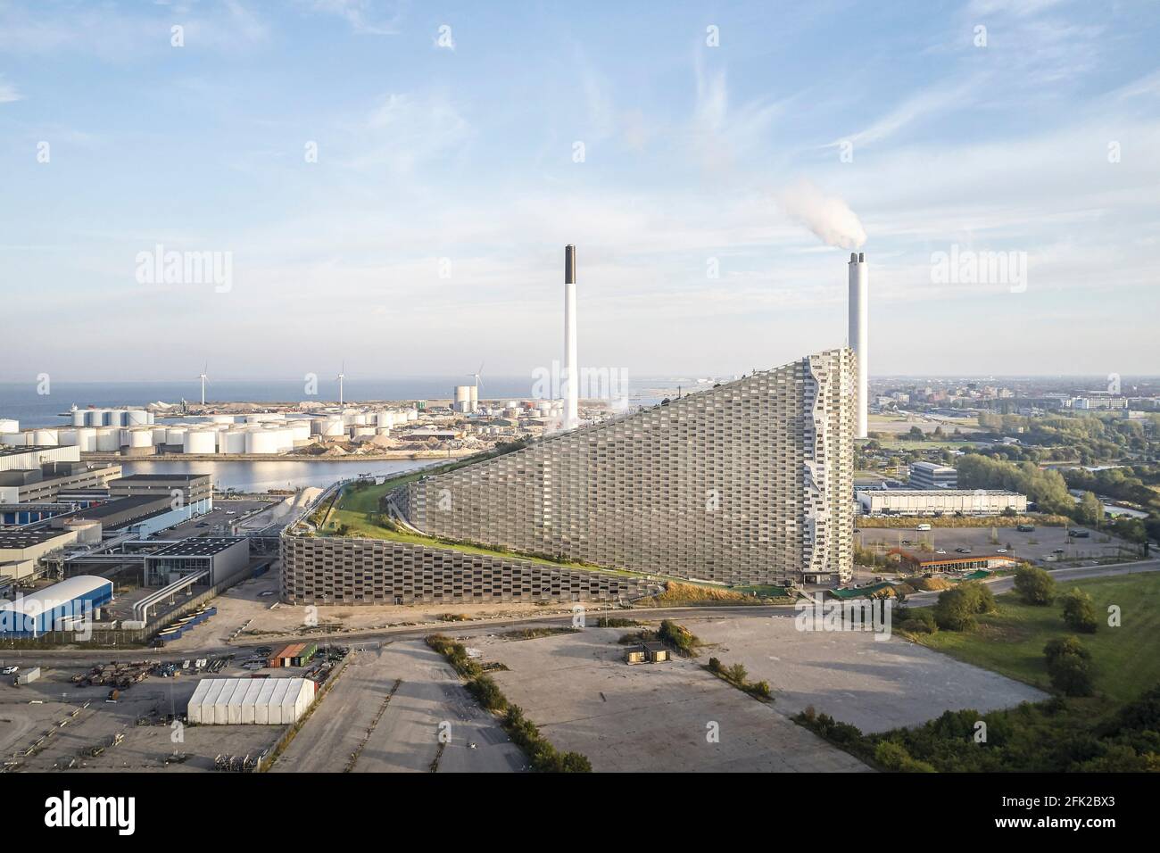 Distant view with clouds. CoppenHill Power Plant, Copenhagen, Denmark. Architect: BIG Bjarke Ingels Group, 2019. Stock Photo