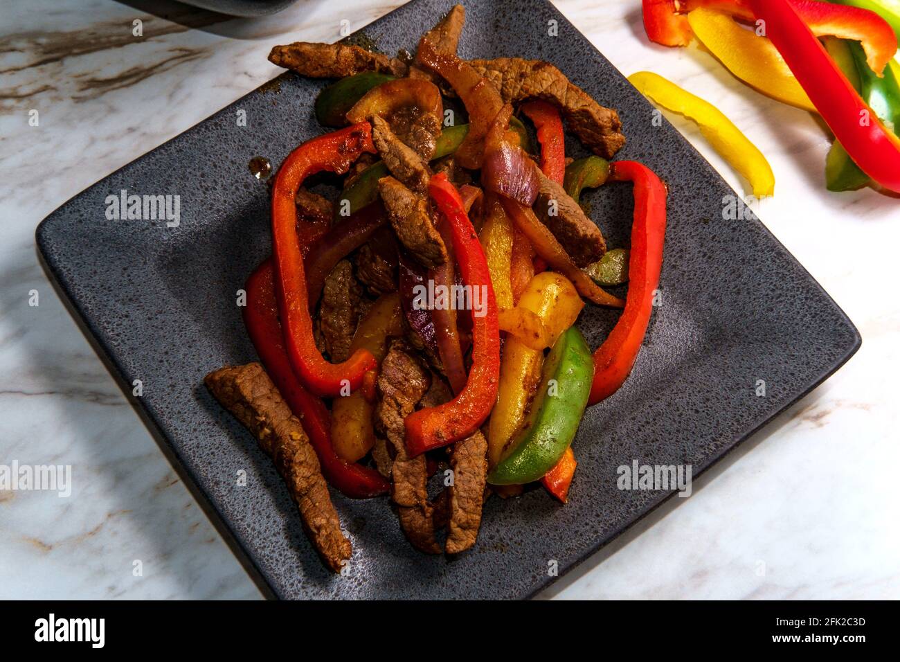 Mexican steak fajitas with fried corn tortillas and guacamole Stock
