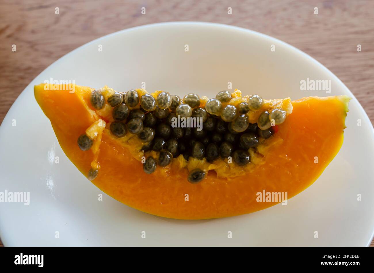 Papaya Slice On A Plate Stock Photo