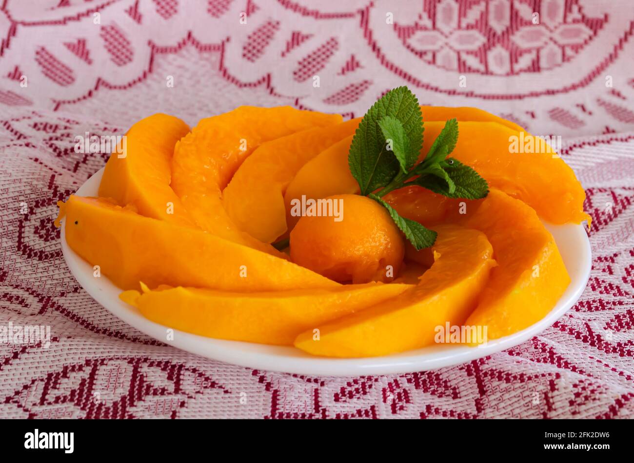 Papaya Slices In A Plate Garnished Stock Photo