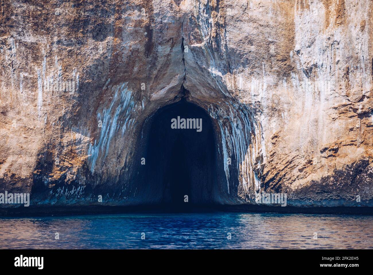 Blue sea and the characteristic caves of Cala Luna, a beach in the Golfo di  Orosei, Sardinia, Italy. Big sea caves in the mediterranean coast. Sardini  Stock Photo - Alamy