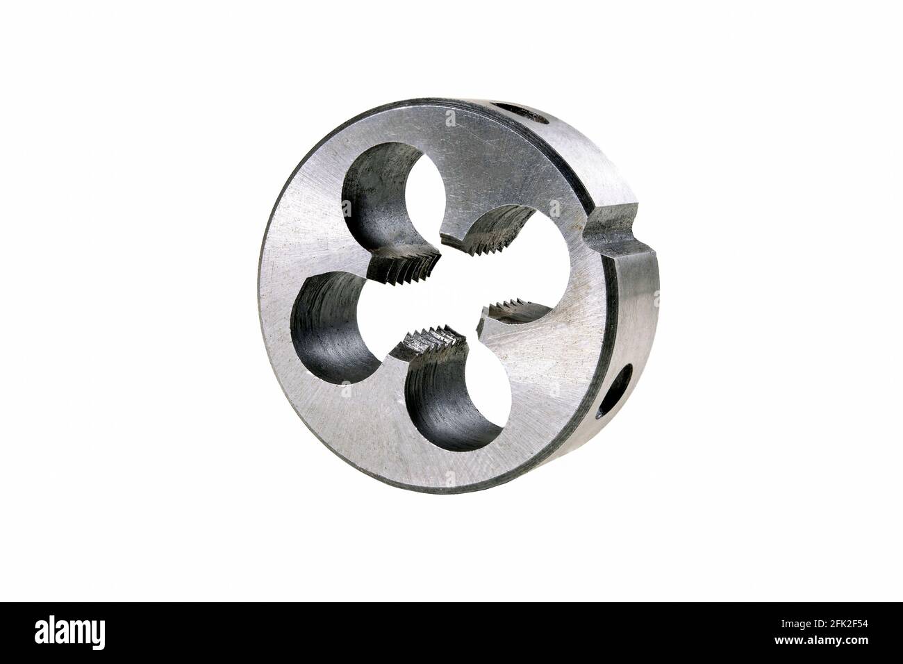 Metal die for cutting metric threads. Accessories used in a mechanical