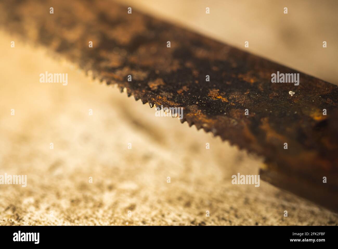 Rusty saw teeth close-up, macro photo of an old unusable tool Stock Photo
