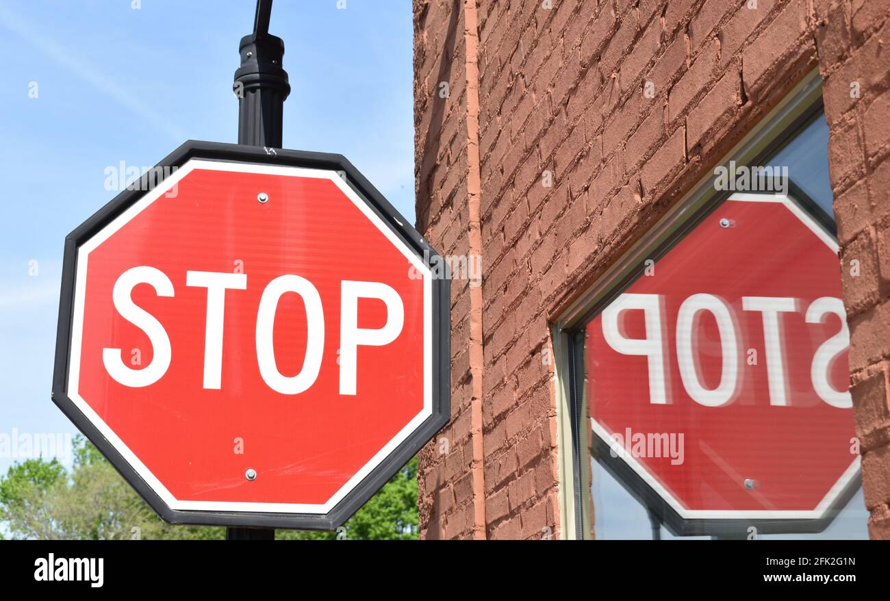 Stop sign reflection in a window Stock Photo Alamy