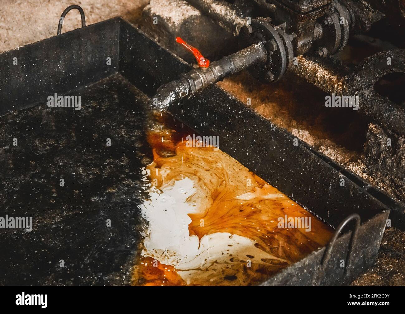 Drain oilcondensate mixture from an air compressor at an industrial